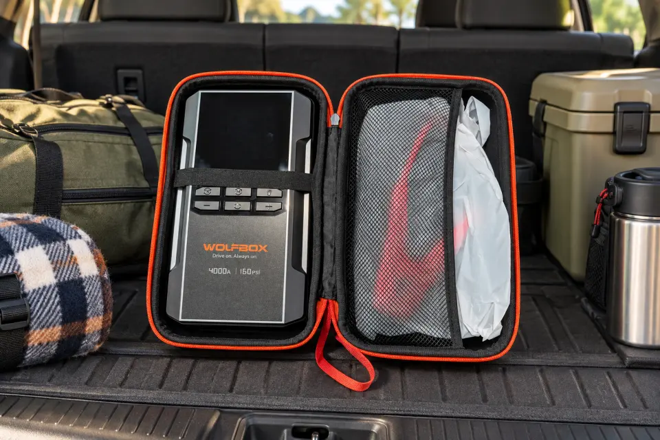 WOLFBOX MegaVolt24 Air in its open carry case inside an SUV cargo area